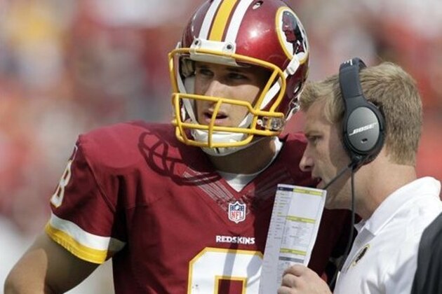 Washington Redskins quarterback Kirk Cousins (8) listens to offensive coordinator Sean McVay, during the second half of an NFL football game against the Jacksonville Jaguars Sunday, Sept. 14, 2014, in Landover, Md. The Redskins won 41-10. (AP Photo/Mark E. Tenally)