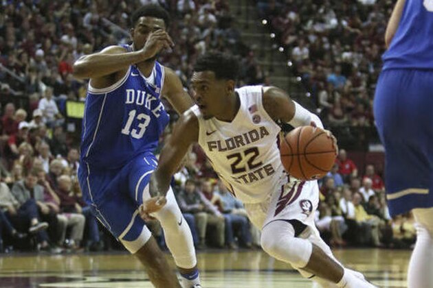 Florida State's Xavier Rathan-Mayes drives the ball up court against Duke's Matt Jones in the second half of an NCAA college basketball game, Tuesday, Jan. 10, 2017, in Tallahassee, Fla. Florida State won 88-72. (AP Photo/Steve Cannon)