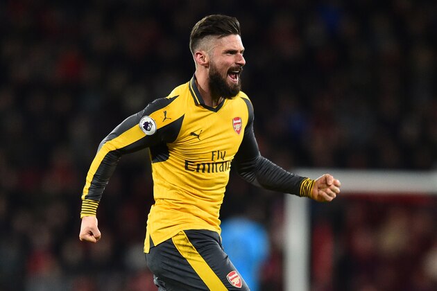 Arsenal's French striker Olivier Giroud celebrates after Arsenal score their second goal during the English Premier League football match between Bournemouth and Arsenal at the Vitality Stadium in Bournemouth, southern England on January 3, 2017. / AFP / Glyn KIRK / RESTRICTED TO EDITORIAL USE. No use with unauthorized audio, video, data, fixture lists, club/league logos or 'live' services. Online in-match use limited to 75 images, no video emulation. No use in betting, games or single club/league/player publications.  /         (Photo credit should read GLYN KIRK/AFP/Getty Images)