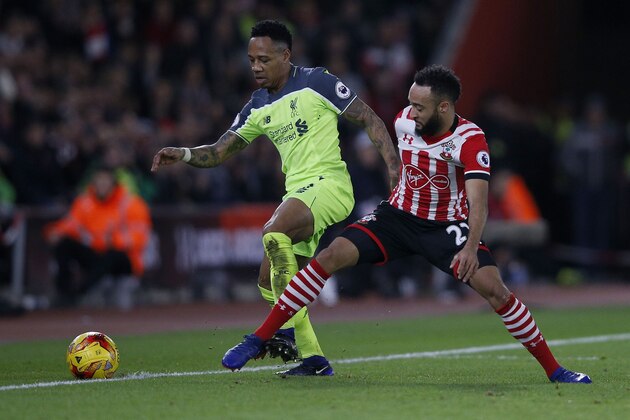 Liverpool's English defender Nathaniel Clyne (L) vies with Southampton's English midfielder Nathan Redmond during the EFL (English Football League) Cup semi-final first-leg football match between Southampton and Liverpool at St Mary's Stadium in Southampton, southern England on October January 11, 2017. / AFP / Adrian DENNIS / RESTRICTED TO EDITORIAL USE. No use with unauthorized audio, video, data, fixture lists, club/league logos or 'live' services. Online in-match use limited to 75 images, no video emulation. No use in betting, games or single club/league/player publications.  /         (Photo credit should read ADRIAN DENNIS/AFP/Getty Images)
