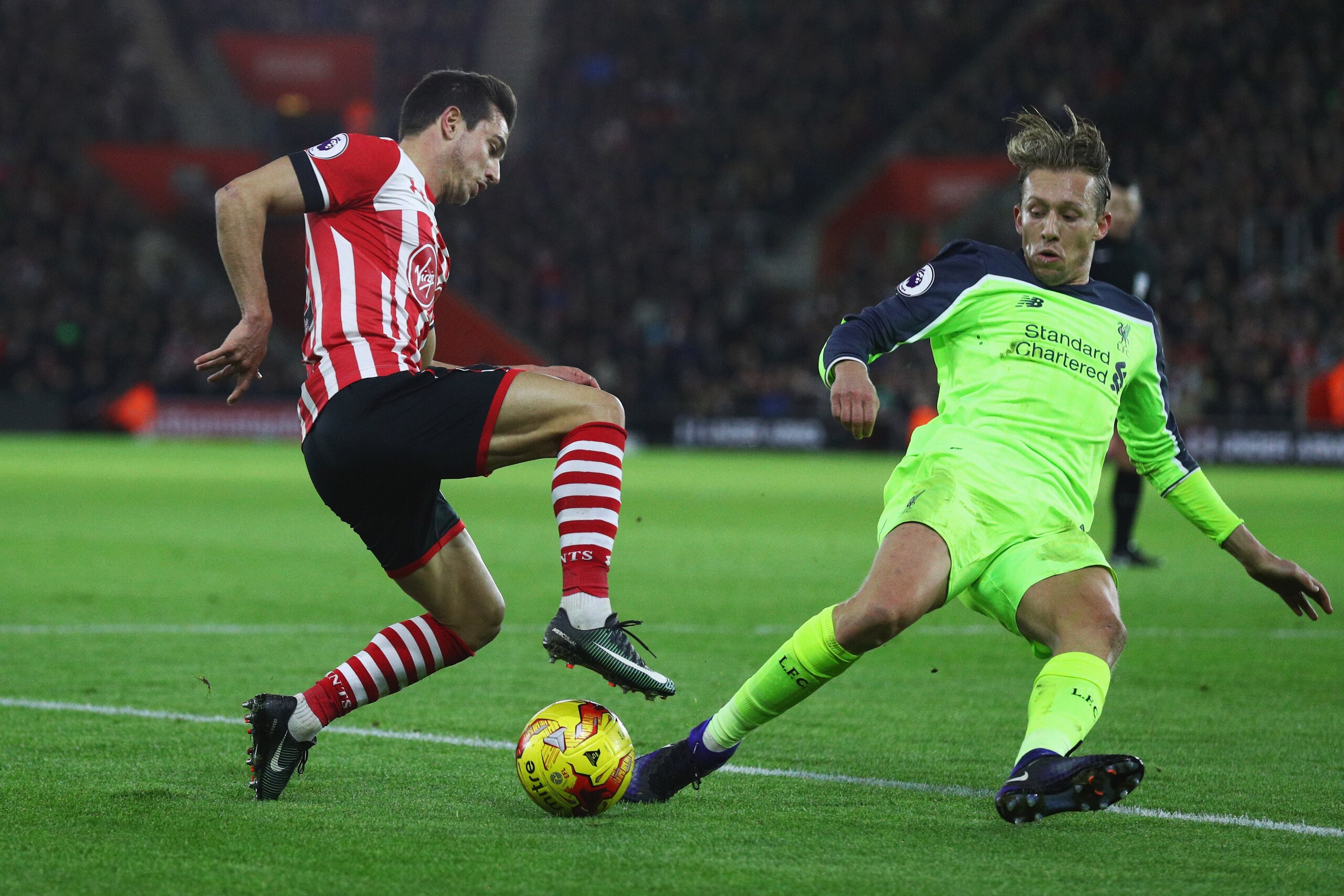 SOUTHAMPTON, ENGLAND - JANUARY 11: Cedric Soares of Southampton takes on Lucas Leiva of Liverpool during the EFL Cup semi-final first leg match between Southampton and Liverpool at St Mary's Stadium on January 11, 2017 in Southampton, England. (Photo by Ian Walton/Getty Images) SOUTHAMPTON, ENGLAND - JANUARY 11: Cedric Soares of Southampton takes on Lucas Leiva of Liverpool during the EFL Cup semi-final first leg match between Southampton and Liverpool at St Mary's Stadium on January 11, 2017 in Southampton, England. (Photo by Ian Walton/Getty Images)