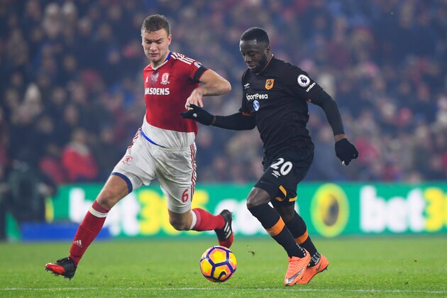MIDDLESBROUGH, ENGLAND - DECEMBER 05:  Adama Diomande of Hull City battles with Ben Gibson of Middlesbrough during the Premier League match between Middlesbrough and Hull City at Riverside Stadium on December 5, 2016 in Middlesbrough, England.  (Photo by Stu Forster/Getty Images)