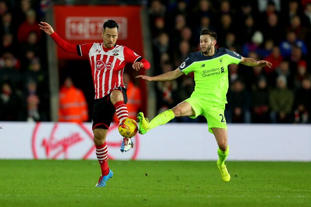 SOUTHAMPTON, ENGLAND - JANUARY 11:  Maya Yoshida of Southampton and Adam Lallana of Liverpool during the EFL Cup semi-final first leg match between Southampton and Liverpool at St Mary's Stadium on January 11, 2017 in Southampton, England. (Photo by Catherine Ivill - AMA/Getty Images)