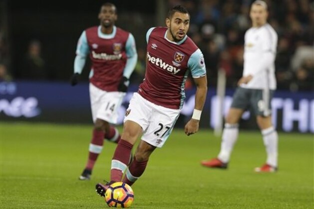 West Ham United’s Dimitri Payet looks to pass the ball during their English Premier League soccer match between West Ham United and Manchester United at the London stadium, in London Monday, Jan.  2,  2017. (AP Photo/Alastair Grant)