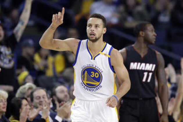 Golden State Warriors' Stephen Curry (30) points after scoring against the Miami Heat during the first half of an NBA basketball game Tuesday, Jan. 10, 2017, in Oakland, Calif. (AP Photo/Marcio Jose Sanchez)