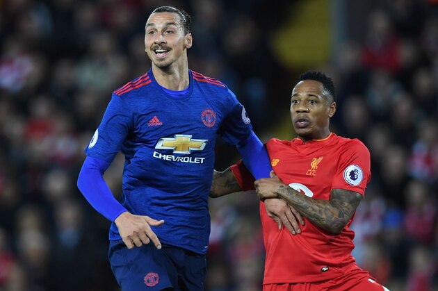 Liverpool's English defender Nathaniel Clyne (R) marks Manchester United's Swedish striker Zlatan Ibrahimovic during the English Premier League football match between Liverpool and Manchester United at Anfield in Liverpool, north west England on October 17, 2016. / AFP / Paul ELLIS / RESTRICTED TO EDITORIAL USE. No use with unauthorized audio, video, data, fixture lists, club/league logos or 'live' services. Online in-match use limited to 75 images, no video emulation. No use in betting, games or single club/league/player publications.  /         (Photo credit should read PAUL ELLIS/AFP/Getty Images)