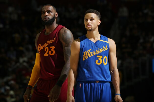 CLEVELAND, OH - DECEMBER 25:  LeBron James #23 of the Cleveland Cavaliers and Stephen Curry #30 of the Golden State Warriors react to a play during the game on December 25, 2016 at Quicken Loans Arena in Cleveland, Ohio. NOTE TO USER: User expressly acknowledges and agrees that, by downloading and/or using this Photograph, user is consenting to the terms and conditions of the Getty Images License Agreement. Mandatory Copyright Notice: Copyright 2016 NBAE  (Photo by David Sherman/NBAE via Getty Images)