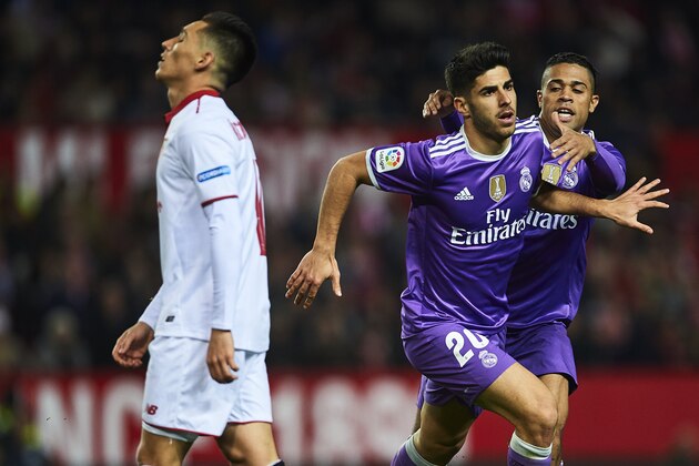 SEVILLE, SPAIN - JANUARY 12:  Marco Asensio of Real Madrid CF celebrates after scoring the first goal of Real Madrid CF with his team mate Mariano Diaz of Real Madrid CF during the Copa del Rey Round of 16 Second Leg match between Sevilla FC vs Real Madrid CF at Ramon Sanchez Pizjuan stadium on January 12, 2017 in Seville, Spain.  (Photo by Aitor Alcalde/Getty Images)