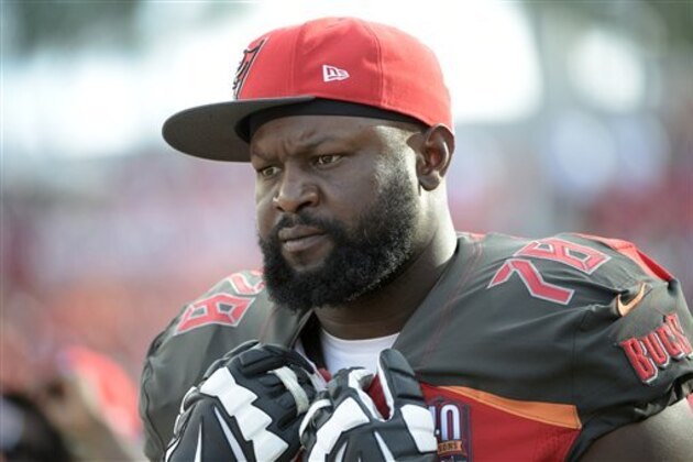 Tampa Bay Buccaneers tackle Gosder Cherilus (78) watches from the sideline during the second half of an NFL football game against the Chicago Bears in Tampa, Fla., Sunday, Dec. 27, 2015. The Bears won 26-21. (AP Photo/Phelan M. Ebenhack)