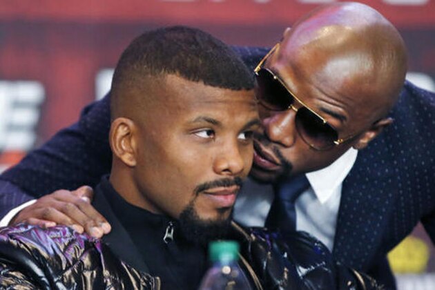 Boxing promoter Floyd Mayweather Jr., right, speaks to protege and WBC Super Middleweight World Champion Johannes Gabriel Badou Nyberg, also known as