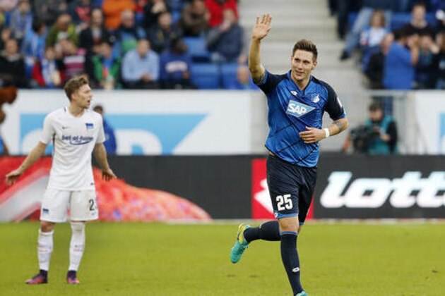 Hoffenheim's Niklas Suele celebrates his side's opening goal during a German first division Bundesliga soccer match between TSG 1899 Hoffenheim and Hertha BSC Berlin in Sinsheim, Germany, Sunday, Oct. 30, 2016.(AP Photo/Michael Probst)
