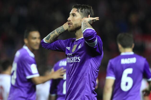 Real Madrid's Sergio Ramos celebrates after scoring against Sevilla during a Spain's King's Cup soccer match between Real Madrid and Sevilla at the Ramon Sanchez Pizjuan stadium, in Seville, Spain on Thursday, Jan. 12, 2017. (AP Photo/Angel Fernandez)