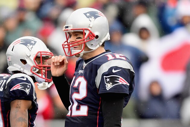 FOXBORO, MA - DECEMBER 24:  Tom Brady #12 of the New England Patriots reacts after throwing a touchdown pass during the second quarter of a game against the New York Jets at Gillette Stadium on December 24, 2016 in Foxboro, Massachusetts.  (Photo by Billie Weiss/Getty Images)