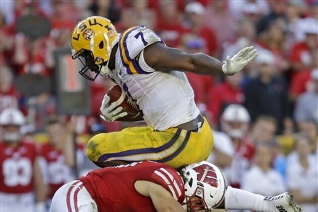 LSU's Leonard Fournette is tackled by Wisconsin's Leo Musso during an NCAA college football game Saturday, Sept. 3, 2016 in Green Bay, Wis. (AP Photo/Aaron Gash)