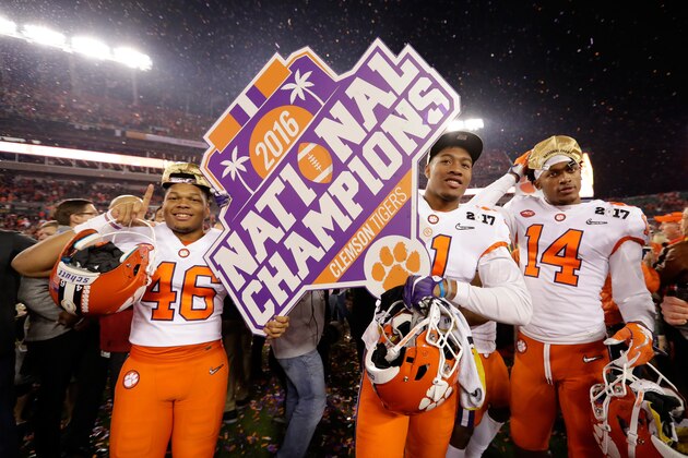 TAMPA, FL - JANUARY 09:  (L-R) Linebacker Jarvis Magwood #46, safety Isaiah Simmons #11 and wide receiver Diondre Overton #14 of the Clemson Tigers celebrate after defeating the Alabama Crimson Tide 35-31 to win the 2017 College Football Playoff National Championship Game at Raymond James Stadium on January 9, 2017 in Tampa, Florida.  (Photo by Jamie Squire/Getty Images)