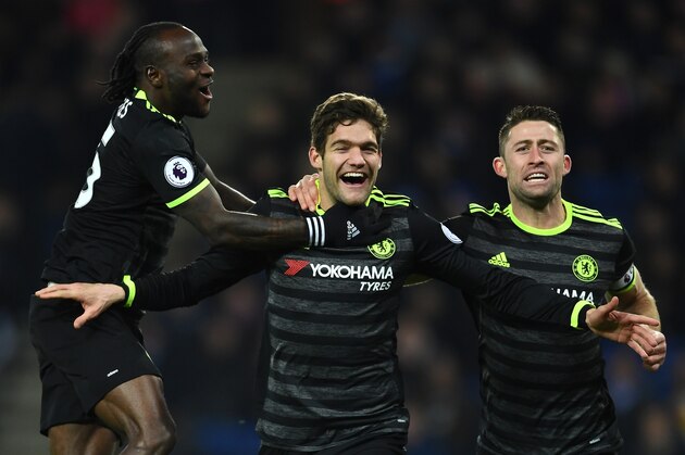 LEICESTER, ENGLAND - JANUARY 14:  Marcos Alonso (C) of Chelsea celebrates with teammates Victor Moses (L) and Gary Cahill (R) after scoring his team's second goal during the Premier League match between Leicester City and Chelsea at The King Power Stadium on January 14, 2017 in Leicester, England.  (Photo by Laurence Griffiths/Getty Images)