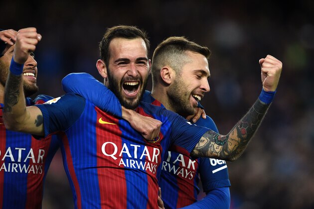 Barcelona's defender Aleix Vidal celebrates after scoring a goal during the Spanish league football match FC Barcelona vs UD Las Palmas at the Camp Nou stadium in Barcelona on January 14, 2017. / AFP / LLUIS GENE        (Photo credit should read LLUIS GENE/AFP/Getty Images)