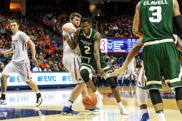 BOISE, ID - DECEMBER 31: Forward Emmanuel Omogbo #2 of the Colorado State Rams dribbles into the key against the defense of forward Nick Duncan #13 of the Boise State Broncos during second half action on December 31, 2016 at Taco Bell Arena in Boise, Idaho. Boise State won the game 74-73. (Photo by Loren Orr/Getty Images)