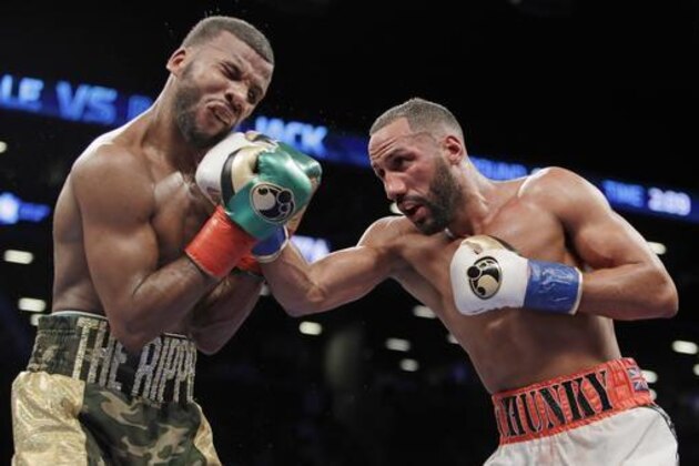 James DeGale, right, of England, punches Badou Jack, of Sweden, during the ninth round of a boxing bout Saturday, Jan. 14, 2017, in New York. The bout ended in a majority draw. (AP Photo/Frank Franklin II)