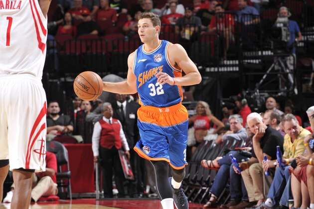 HOUSTON, TX - OCTOBER 2:  Jimmer Fredette #32 of the Shanghai Sharks drives to the basket against the Houston Rockets during a preseason game on October 2, 2016 at the Toyota Center in Houston, Texas. NOTE TO USER: User expressly acknowledges and agrees that, by downloading and or using this photograph, User is consenting to the terms and conditions of the Getty Images License Agreement. Mandatory Copyright Notice: Copyright 2016 NBAE (Photo by Bill Baptist/NBAE via Getty Images)