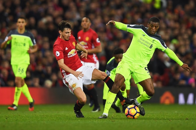 MANCHESTER, ENGLAND - JANUARY 15:  Matteo Darmian of Manchester United and Georginio Wijnaldum of Liverpool battle for the ball during the Premier League match between Manchester United and Liverpool at Old Trafford on January 15, 2017 in Manchester, England.  (Photo by Mike Hewitt/Getty Images)