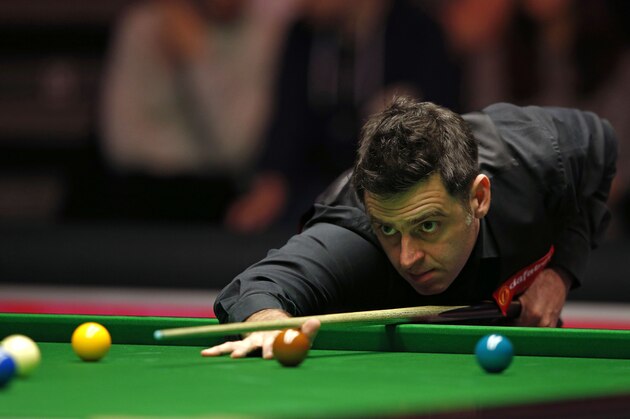 England's Ronnie O'Sullivan plays a shot during his first round match against China's Liang Wenbo during the Masters Snooker tournament at Alexandra Palace in London, on January 15, 2017. / AFP / Adrian DENNIS        (Photo credit should read ADRIAN DENNIS/AFP/Getty Images)