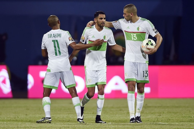 Algeria's forward Riyad Mahrez (C) celebrates with Algeria's midfielder Yacine Brahimi (R) and Algeria's forward Islam Slimani after scoring a second goal during the 2017 Africa Cup of Nations group B football match between Algeria and Zimbabwe in Franceville on January 15, 2017. / AFP / KHALED DESOUKI        (Photo credit should read KHALED DESOUKI/AFP/Getty Images)