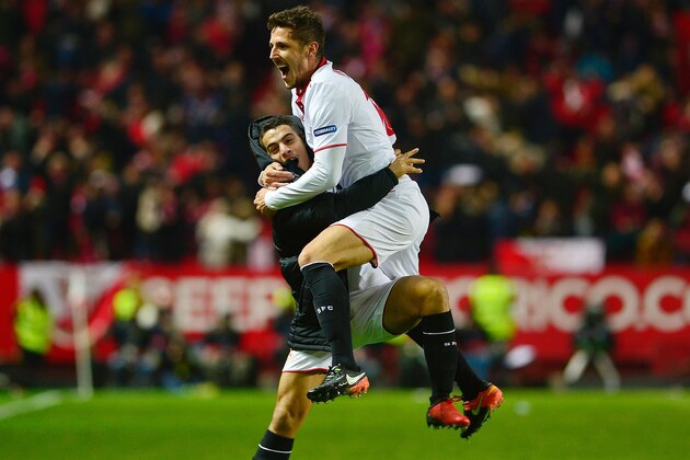Sevilla's Montenegrin forward Stevan Jovetic (R) celebrates with Sevilla's French forward Wissam Ben Yedder after scoring the 2-1 victory goal during the Spanish league football match Sevilla FC vs Real Madrid CF at the Ramon Sanchez Pizjuan stadium in Sevilla on January 15, 2017.
Sevilla won 2-1. / AFP / CRISTINA QUICLER        (Photo credit should read CRISTINA QUICLER/AFP/Getty Images)