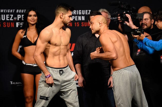 PHOENIX, ARIZONA - JANUARY 14:  (L-R) Yair Rodriguez of Mexico and BJ Penn face off during the UFC Fight Night weigh-in at the Talking Stick Resort Arena on January 14, 2017 in Phoenix, Arizona. (Photo by Jeff Bottari/Zuffa LLC/Zuffa LLC via Getty Images)