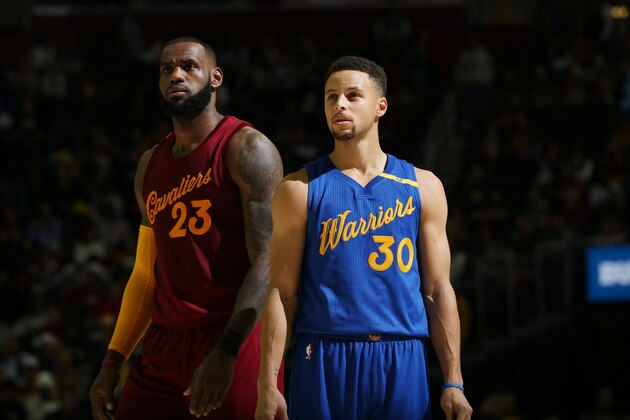 CLEVELAND, OH - DECEMBER 25:  LeBron James #23 of the Cleveland Cavaliers and Stephen Curry #30 of the Golden State Warriors react to a play during the game on December 25, 2016 at Quicken Loans Arena in Cleveland, Ohio. NOTE TO USER: User expressly acknowledges and agrees that, by downloading and/or using this Photograph, user is consenting to the terms and conditions of the Getty Images License Agreement. Mandatory Copyright Notice: Copyright 2016 NBAE  (Photo by David Sherman/NBAE via Getty Images)