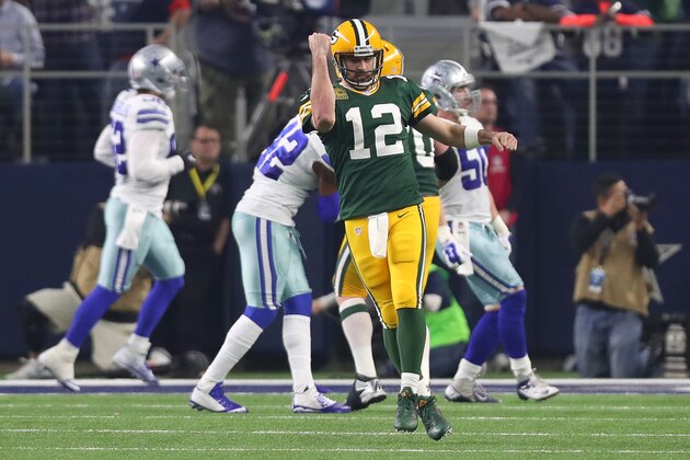 ARLINGTON, TX - JANUARY 15:  Aaron Rodgers #12 of the Green Bay Packers celebrates after throwing a touchdown pass during the third quarter against the Dallas Cowboys in the NFC Divisional Playoff game at AT&T Stadium on January 15, 2017 in Arlington, Texas.  (Photo by Tom Pennington/Getty Images)