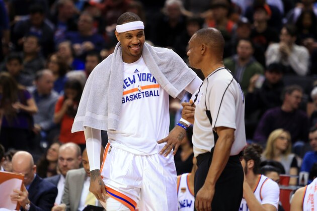 TORONTO, ON - JANUARY 15:  Carmelo Anthony #7 of the New York Knicks jokes with an official during the second half of an NBA game against the Toronto Raptors at Air Canada Centre on January 15, 2017 in Toronto, Canada.  NOTE TO USER: User expressly acknowledges and agrees that, by downloading and or using this photograph, User is consenting to the terms and conditions of the Getty Images License Agreement.  (Photo by Vaughn Ridley/Getty Images)