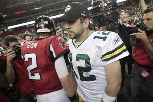 Green Bay Packers quarterback Aaron Rodgers (12) meets Atlanta Falcons quarterback Matt Ryan (2) on the field after the Packers beat the Falcons 48-21 in an NFL divisional playoff football game on Saturday, Jan., 15, 2011, in Atlanta. (AP Photo/Dave Martin)