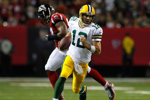 ATLANTA, GA - OCTOBER 30: Aaron Rodgers #12 of the Green Bay Packers rushes awau Dwight Freeney #93 of the Atlanta Falcons at Georgia Dome on October 30, 2016 in Atlanta, Georgia. (Photo by Kevin C. Cox/Getty Images) ATLANTA, GA - OCTOBER 30: Aaron Rodgers #12 of the Green Bay Packers rushes awau Dwight Freeney #93 of the Atlanta Falcons at Georgia Dome on October 30, 2016 in Atlanta, Georgia. (Photo by Kevin C. Cox/Getty Images)
