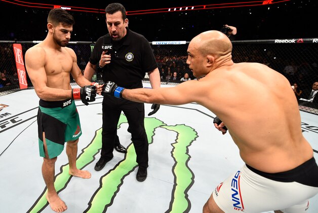 PHOENIX, AZ - JANUARY 15:  (R-L) BJ Penn touches gloves with Yair Rodriguez of Mexico in their featherweight bout during the UFC Fight Night event inside Talking Stick Resort Arena on January 15, 2017 in Phoenix, Arizona. (Photo by Jeff Bottari/Zuffa LLC/Zuffa LLC via Getty Images)