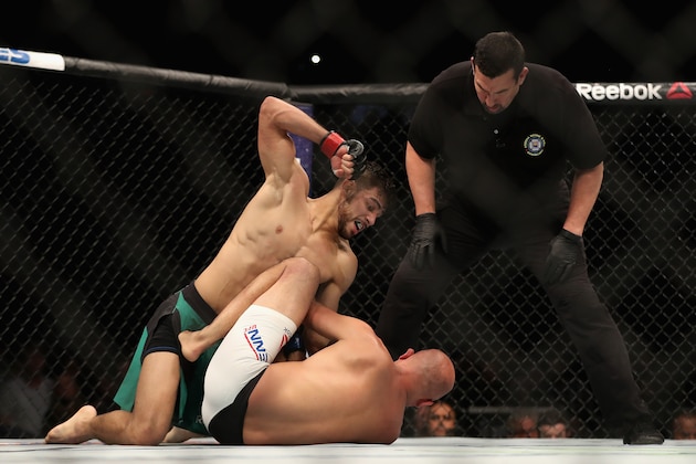PHOENIX, AZ - JANUARY 15:  Yair Rodriguez (R) throws a right onto BJ Penn during the UFC Fight Night event at the at Talking Stick Resort Arena on January 15, 2017 in Phoenix, Arizona.  (Photo by Christian Petersen/Getty Images)