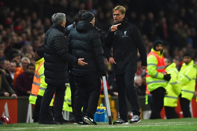 MANCHESTER, ENGLAND - JANUARY 15:  Jose Mourinho manager of Manchester United and Jurgen Klopp manager of Liverpool argue on the touchline the Premier League match between Manchester United and Liverpool at Old Trafford on January 15, 2017 in Manchester, England.  (Photo by Laurence Griffiths/Getty Images)