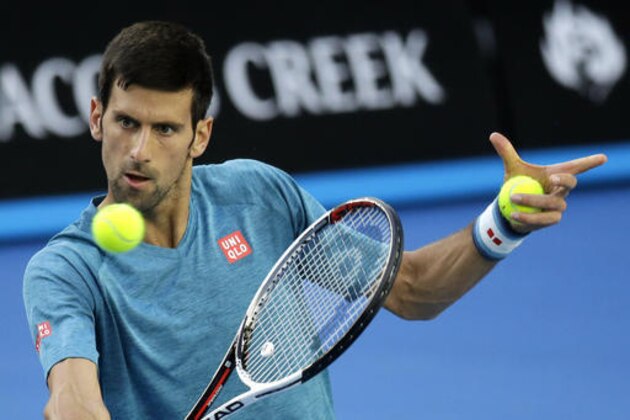 Serbia's Novak Djokovic makes a backhand return during a practice session ahead of the Australian Open tennis championships in Melbourne, Australia, Sunday, Jan. 15, 2017. (AP Photo/Aaron Favila)