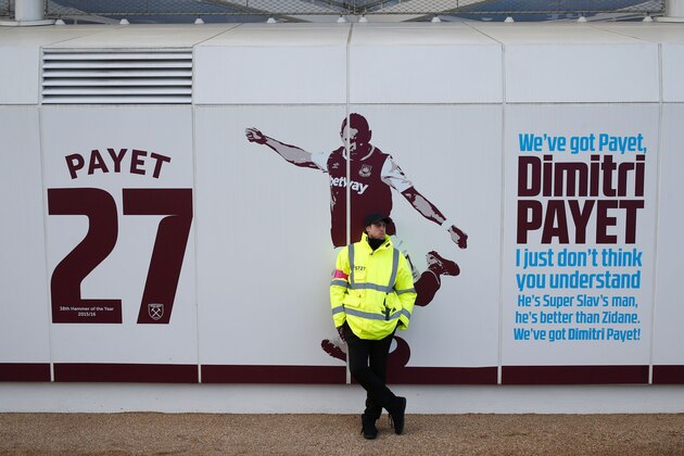 A security guard stands beside the club mural praising West Ham United's French midfielder Dimitri Payet ahead of the English Premier League football match between West Ham United and Crystal Palace at The London Stadium, in east London on January 14, 2017.
West Ham United playmaker Dimitri Payet has informed the club of his desire to leave and no longer wishes to play for them, manager Slaven Bilic revealed on Thursday, 12 January. / AFP / Ian KINGTON / RESTRICTED TO EDITORIAL USE. No use with unauthorized audio, video, data, fixture lists, club/league logos or 'live' services. Online in-match use limited to 75 images, no video emulation. No use in betting, games or single club/league/player publications.  /         (Photo credit should read IAN KINGTON/AFP/Getty Images)