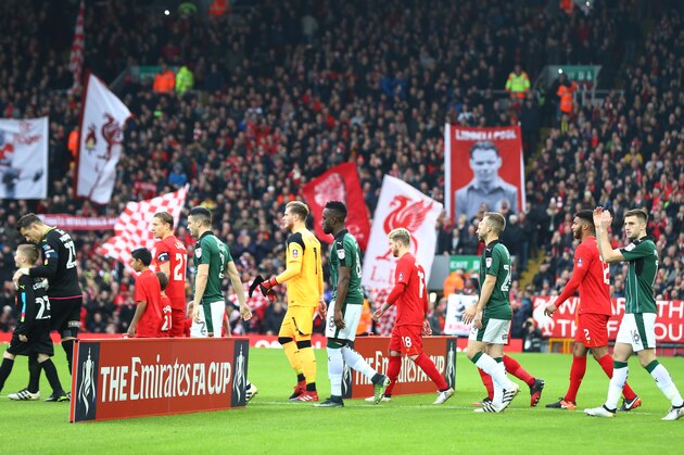 LIVERPOOL, ENGLAND - JANUARY 08: The Liverpool and Plymouth Argyle teams walk out prior to The Emirates FA Cup Third Round match between Liverpool and Plymouth Argyle at Anfield on January 8, 2017 in Liverpool, England.  (Photo by Michael Steele/Getty Images)