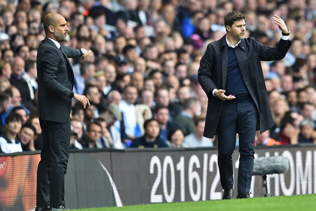 Manchester City's Spanish manager Pep Guardiola (L) and Tottenham Hotspur's Argentinian head coach Mauricio Pochettino gesture on the touchline during the English Premier League football match between Tottenham Hotspur and Manchester City at White Hart Lane in London, on October 2, 2016. / AFP / Glyn KIRK / RESTRICTED TO EDITORIAL USE. No use with unauthorized audio, video, data, fixture lists, club/league logos or 'live' services. Online in-match use limited to 75 images, no video emulation. No use in betting, games or single club/league/player publications.  /         (Photo credit should read GLYN KIRK/AFP/Getty Images)