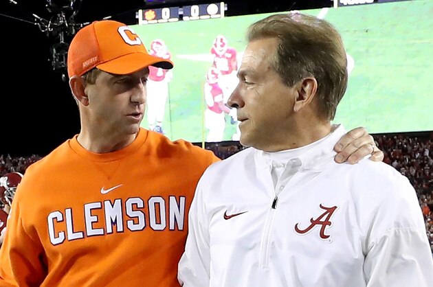 TAMPA, FL - JANUARY 09:  Head coach Dabo Swinney of the Clemson Tigers (L) talks with Head coach Nick Saban of the Alabama Crimson Tide prior to the 2017 College Football Playoff National Championship Game at Raymond James Stadium on January 9, 2017 in Tampa, Florida.  (Photo by Kevin Jairaj - Handout/Getty Images)