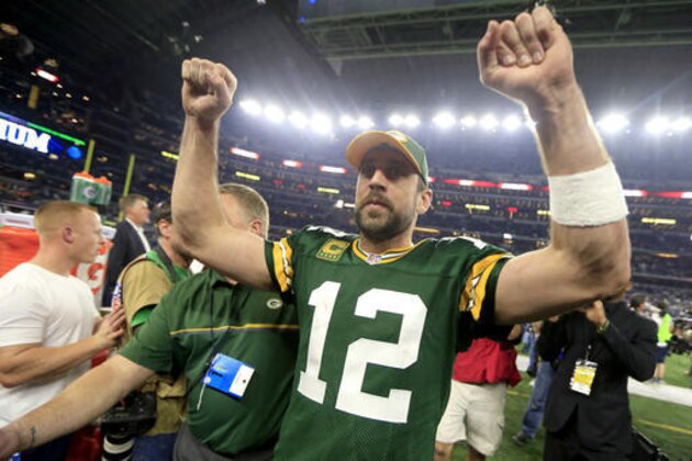 Green Bay Packers quarterback Aaron Rodgers (12) celebrates after winning an NFL divisional playoff football game against the Dallas Cowboys Sunday, Jan. 15, 2017, in Arlington, Texas. The Packers won 34-31. (AP Photo/Ron Jenkins)