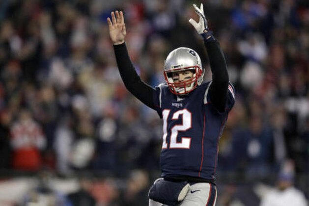 New England Patriots quarterback Tom Brady celebrates a touchdown by running back Dion Lewis during the second half of an NFL divisional playoff football game against the Houston Texans, Saturday, Jan. 14, 2017, in Foxborough, Mass. (AP Photo/Charles Krupa)