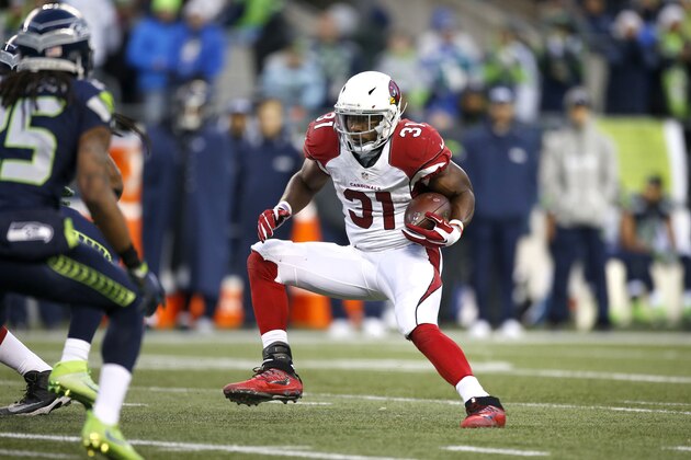 SEATTLE, WA - DECEMBER 24: Running back David Johnson #31 of the Arizona Cardinals rushes against the Seattle Seahawks at CenturyLink Field on December 24, 2016 in Seattle, Washington. (Photo by Otto Greule Jr/Getty Images) SEATTLE, WA - DECEMBER 24: Running back David Johnson #31 of the Arizona Cardinals rushes against the Seattle Seahawks at CenturyLink Field on December 24, 2016 in Seattle, Washington. (Photo by Otto Greule Jr/Getty Images)