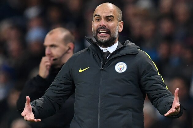 Manchester City's Spanish manager Pep Guardiola gestures on the touchline during the English Premier League football match between Manchester City and Arsenal at the Etihad Stadium in Manchester, north west England, on December 18, 2016.
Manchester City won the game 2-1. / AFP / Paul ELLIS / RESTRICTED TO EDITORIAL USE. No use with unauthorized audio, video, data, fixture lists, club/league logos or 'live' services. Online in-match use limited to 75 images, no video emulation. No use in betting, games or single club/league/player publications.  /         (Photo credit should read PAUL ELLIS/AFP/Getty Images)