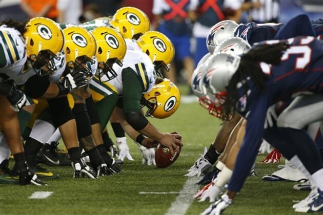 The New England Patriots and the Green Bay Packers at the line of scrimmage before the snap during a NFL preseason football game at Gillette Stadium in Foxborough, Mass. Friday, Aug. 13, 2015. Green Bay beat New England 22-11. (Winslow Townson/AP Images for Panini)