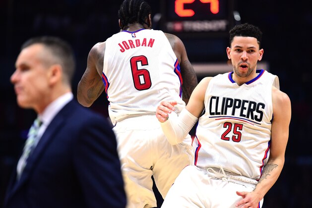 LOS ANGELES, CA - JANUARY 16:  Austin Rivers #25 of the LA Clippers celebrates his three pointer with DeAndre Jordan #6 as Billy Donovan of the Oklahoma City Thunder walks on the floor for a timeout during the first half at Staples Center on January 16, 2017 in Los Angeles, California.  NOTE TO USER: User expressly acknowledges and agrees that, by downloading and or using this photograph, User is consenting to the terms and conditions of the Getty Images License Agreement.  (Photo by Harry How/Getty Images)
