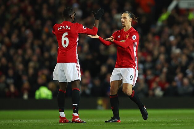MANCHESTER, ENGLAND - NOVEMBER 27: Zlatan Ibrahimovic of Manchester United (R) celebrates scoring his sides first goal with Paul Pogba of Manchester United (L) during the Premier League match between Manchester United and West Ham United at Old Trafford on November 27, 2016 in Manchester, England.  (Photo by Clive Brunskill/Getty Images)