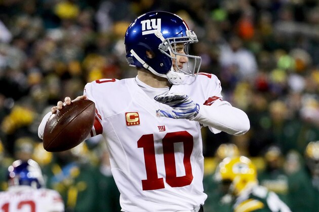 GREEN BAY, WI - JANUARY 8:  Eli Manning #10 of the New York Giants throws a pass in the fourth quarter during the NFC Wild Card game against the Green Bay Packers at Lambeau Field on January 8, 2017 in Green Bay, Wisconsin. (Photo by Jonathan Daniel/Getty Images)